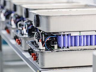 INVENOX battery systems in production on an assembly table.